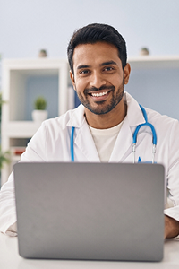 Doctor working on a laptop